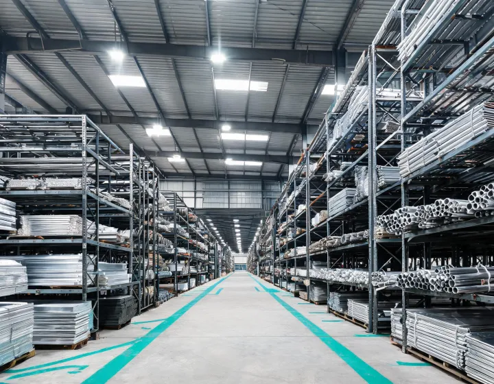 Ryerson metal service center with stacked stainless sheet, aluminum bar and carbon steel plate